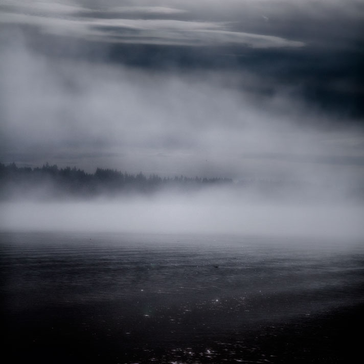 Fog rising over sparkling water. Sinclair Inlet, Bremerton, Washington.